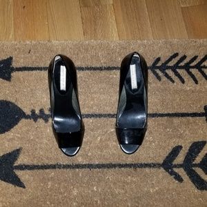 Black patent leather peep toe wedges